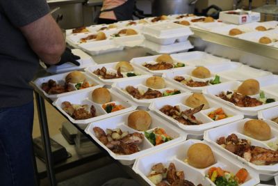 ACTION Grab n Go hot meals being prepared by Cultivate Cafe and Kitchen Incubator staff.